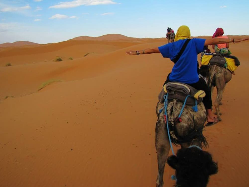 Riding camels through the Sahara Desert