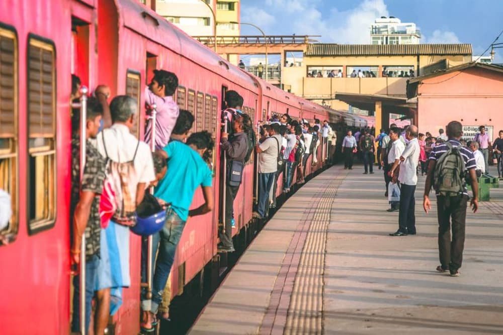 A creative approach to a crowded caboose... just climb onto the side and hang on for dear life