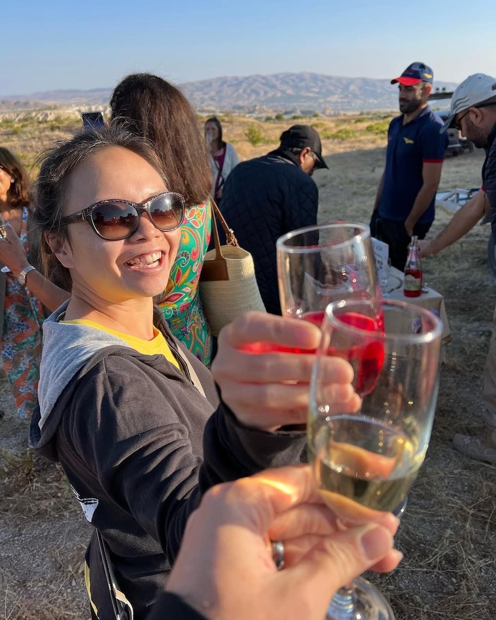 Enjoying a glass of bubbly after our flight