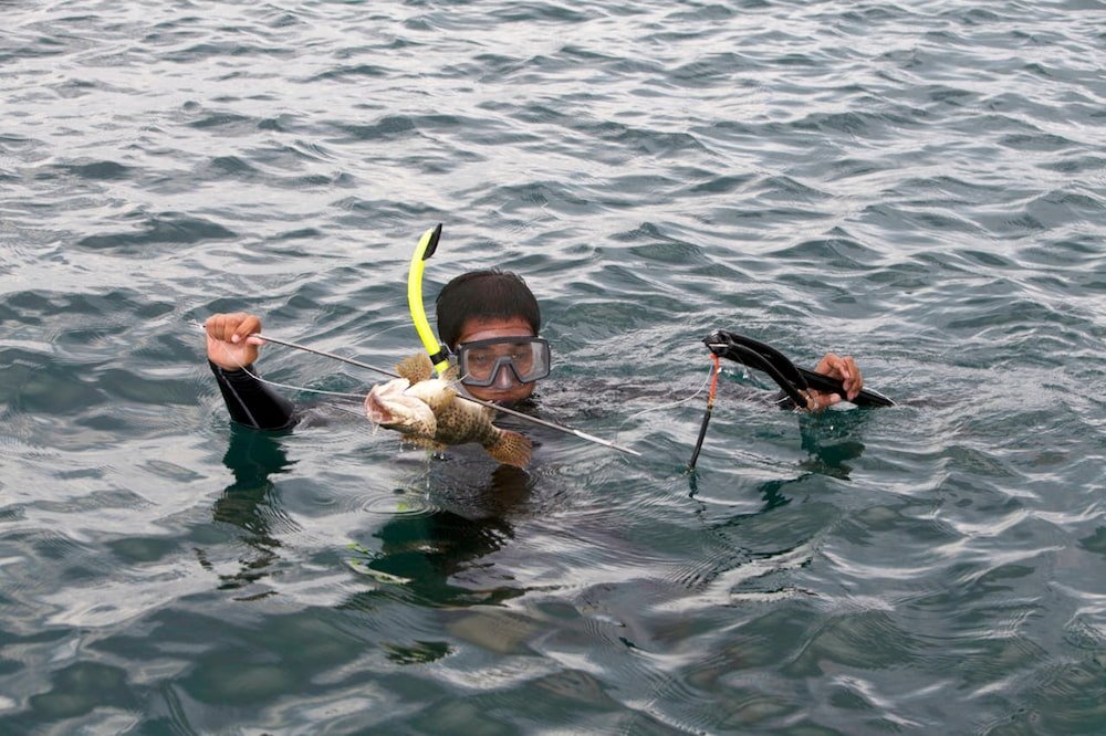 Man with a fish he speared