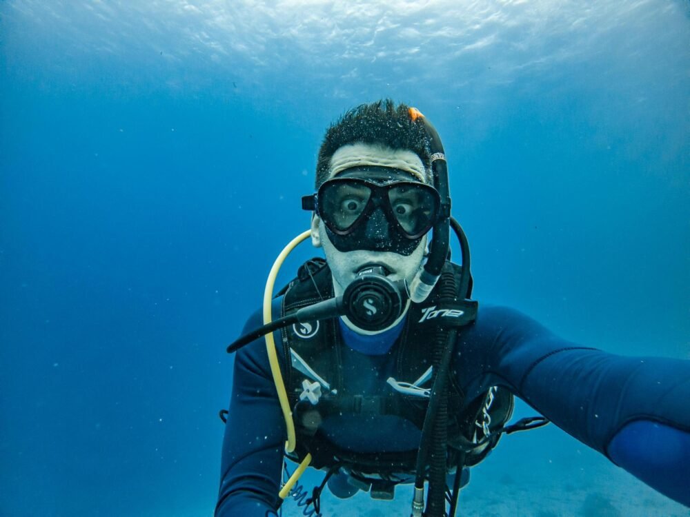 Scuba diver taking a selfie underwater