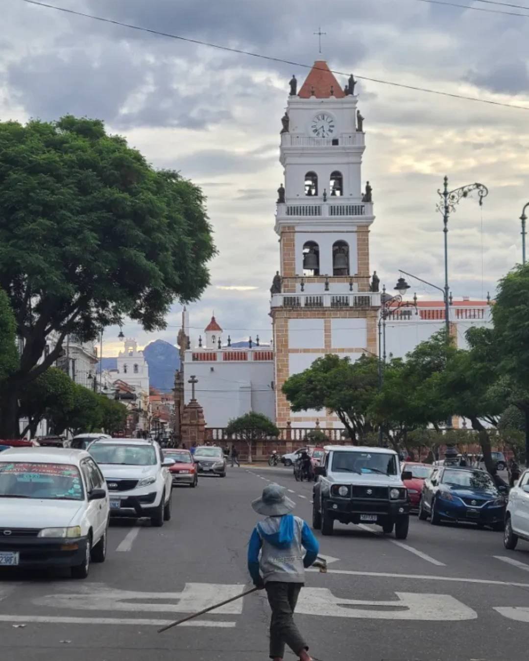 Boy walks across the street in Sucre